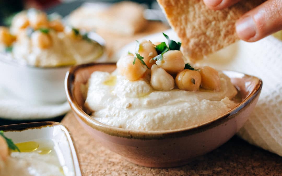 A Bowl of Delicious Hummus and Warm Pita for Dipping